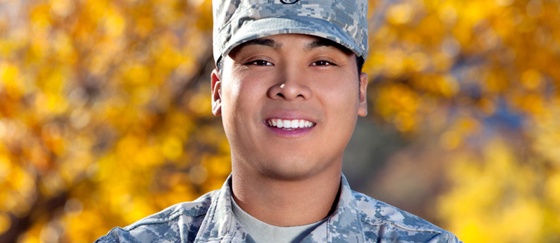 A veteran in military uniform is smiling and happy about training for a new career at ABCO